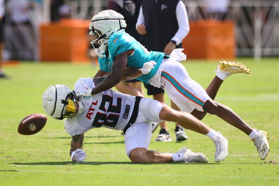 Aug 6, 2024; Miami Gardens, FL, USA; Atlanta Falcons wide receiver Casey Washington (82) battles for a pass against Miami Dolphins cornerback Kader Kohou (4) during a joint practice at Baptist Health Training Complex. Mandatory Credit: Sam Navarro-USA TODAY Sports