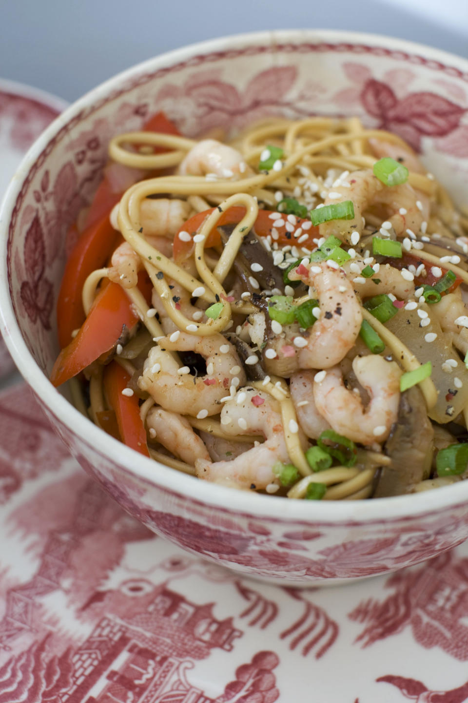 In this image taken on January 14, 2013, shrimp and shitake noodle stir-fry is shown served in a bowl in Concord, N.H. (AP Photo/Matthew Mead)