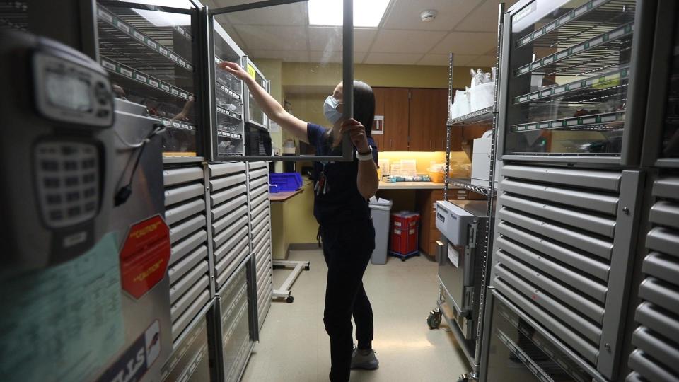 Kendall Piccirilli, a nurse at Unity Hospital in Greece, New York, gets a patient's medication on Oct. 27, 2021.