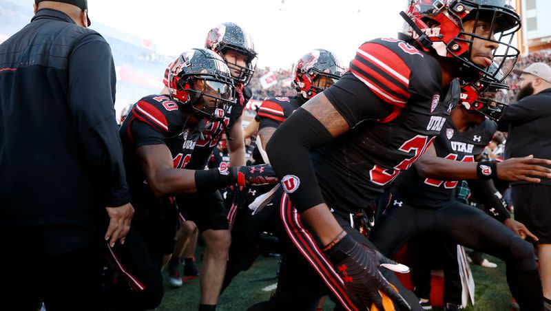 Utah players run out onto the field as they prepare to play USC at Rice Eccles Stadium in Salt Lake CIty on Saturday, Oct. 15, 2022.