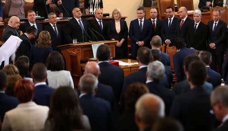 Bulgaria's new Prime Minister Boiko Borisov and members of his cabinet take an oath during a swearing-in ceremony in the parliament in Sofia, Bulgaria May 4, 2017. REUTERS/Stoyan Nenov