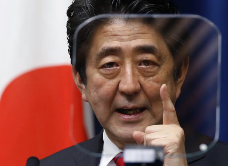 FILE - Japanese Prime Minister Shinzo Abe speaks during a press conference at his official residence in Tokyo on March 20, 2014. Former Japanese Prime Minister Abe, a divisive arch-conservative and one of his nation's most powerful and influential figures, has died after being shot during a campaign speech Friday, July 8, 2022, in western Japan, hospital officials said.(AP Photo/Shizuo Kambayash, File)