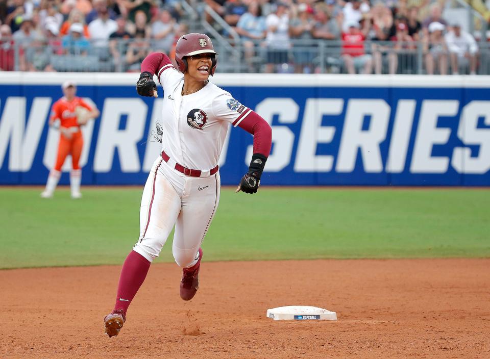 Florida State's Michaela Edenfield (51) celebrates a home run in the first inning during a softball game between Oklahoma State Cowgirls and Florida State in the Women's College World Series at USA Softball Hall of Fame Stadium in  in Oklahoma City, Thursday, June, 1, 2023.