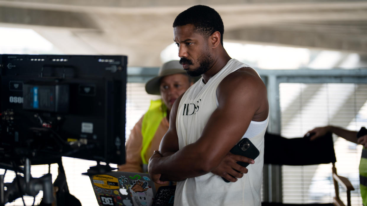  Michael B. Jordan looking at monitor on the Creed III set 