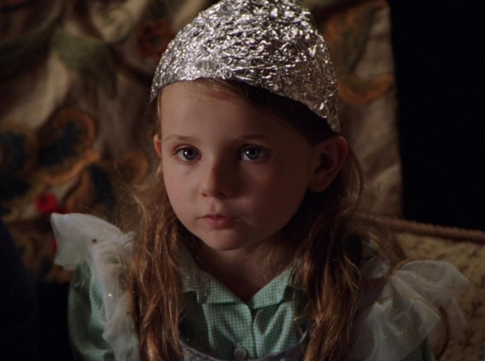 Abigail Breslin as Bo Hess wears a tin foil hat in "Signs"