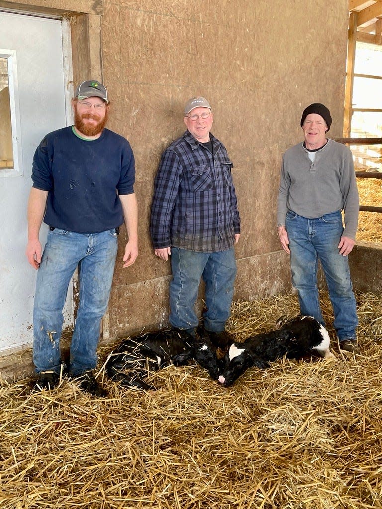 Scott, Tim and Brian Specht welcome newborn ProCROSS twins to their 350-cow dairy in Auburn Township in the  Ragersville area.