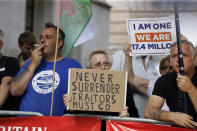 Brexit supporting protesters hold banners outside the Supreme Court in London, Tuesday Sept. 17, 2019. The Supreme Court is set to decide whether Prime Minister Boris Johnson broke the law when he suspended Parliament on Sept. 9, sending lawmakers home until Oct. 14 — just over two weeks before the U.K. is due to leave the European Union. (AP Photo/Matt Dunham)