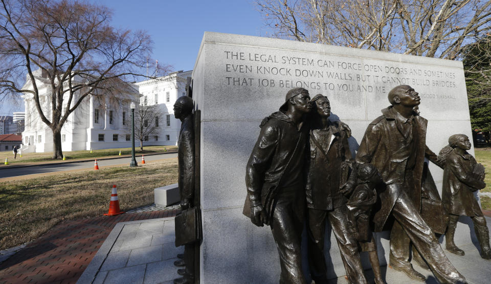 In this Feb. 5, 2019, photo, a statue commemorating the African-American students whose 1951 school walkout became a key moment in the civil-rights movement sits on the grounds of the Capitol in Richmond, Va. Virginia has become more diverse and socially liberal in recent years. But the state continues to struggle with mindsets shaped by its turbulent racial history. When a racist photo was discovered last week on Gov. Ralph Northam’s 1984 medical school yearbook page, it exposed how much deeply embedded racism still lurks in the state. (AP Photo/Steve Helber)