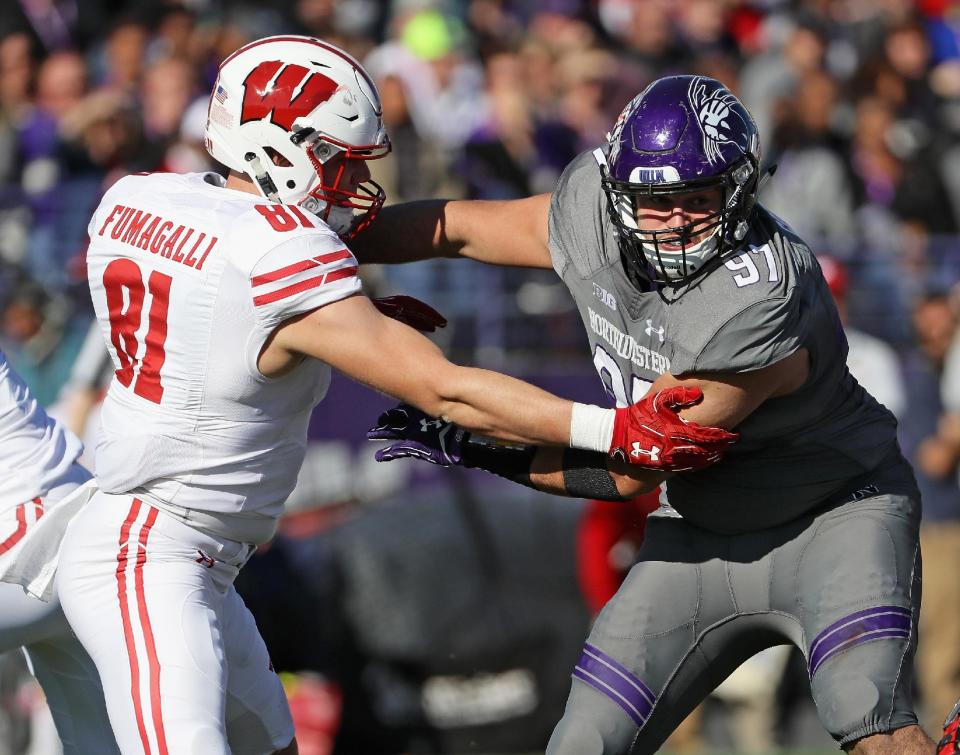 Northwestern’s Joe Gaziano rushes against Wisconsin’s Troy Fumagalli on Nov. 5, 2016 in Evanston, Illinois. (Getty)