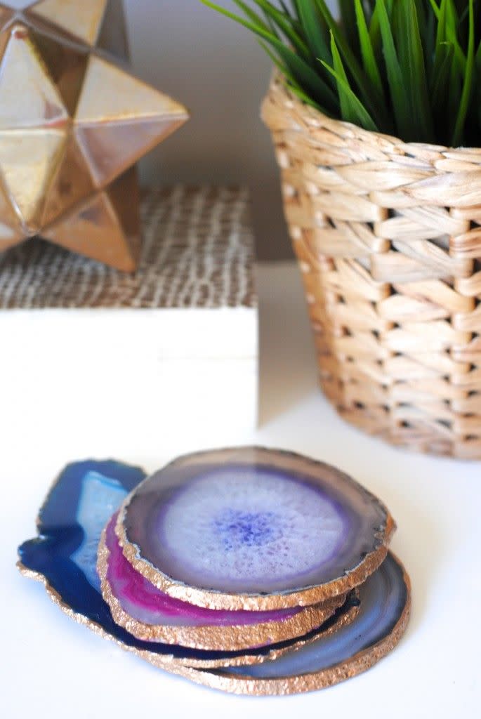 <p>Trendy agate gets a metallic accent in this surprisingly easy project. Plus, the set will make up for all the times you didn't use a coaster growing up. </p><p><em><a href="http://makinglemonadeblog.com/how-to-make-gilded-edge-agate-coasters/" rel="nofollow noopener" target="_blank" data-ylk="slk:Get the tutorial at Making Lemonade »;elm:context_link;itc:0;sec:content-canvas" class="link ">Get the tutorial at Making Lemonade »</a></em><br></p>