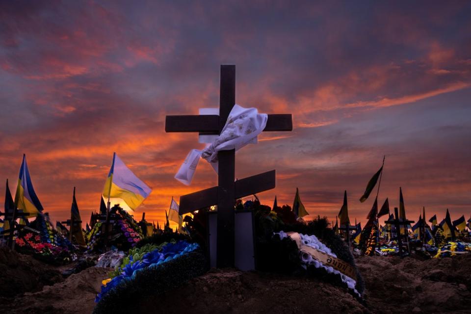 A colorful sunset over military graves in the Kharkiv cemetery 18 on March 15, 2023. The military section of this large cemetery is almost full as many fallen soldiers come from Kharkiv. (Paula Bronstein /Getty Images)