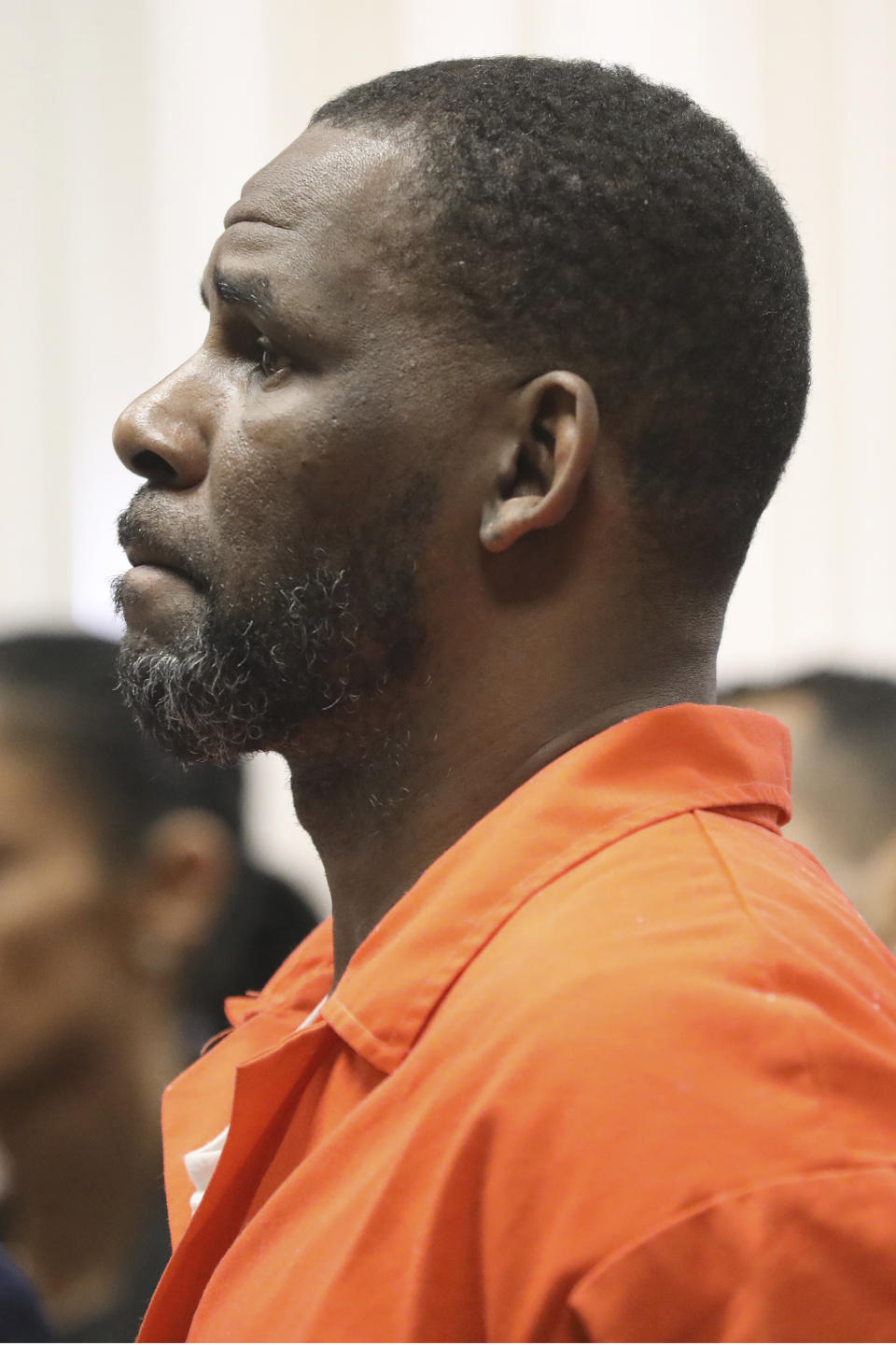 R. Kelly appears during a hearing at the Leighton Criminal Courthouse on Tuesday, Sept. 17, 2019 in Chicago. A judge in R. Kelly's Illinois sexual assault case has refused to give $100,000 in bail money back to a Kelly friend who paid it in February to secure the singer's release from county jail. (Antonio Perez/ via AP Pool)