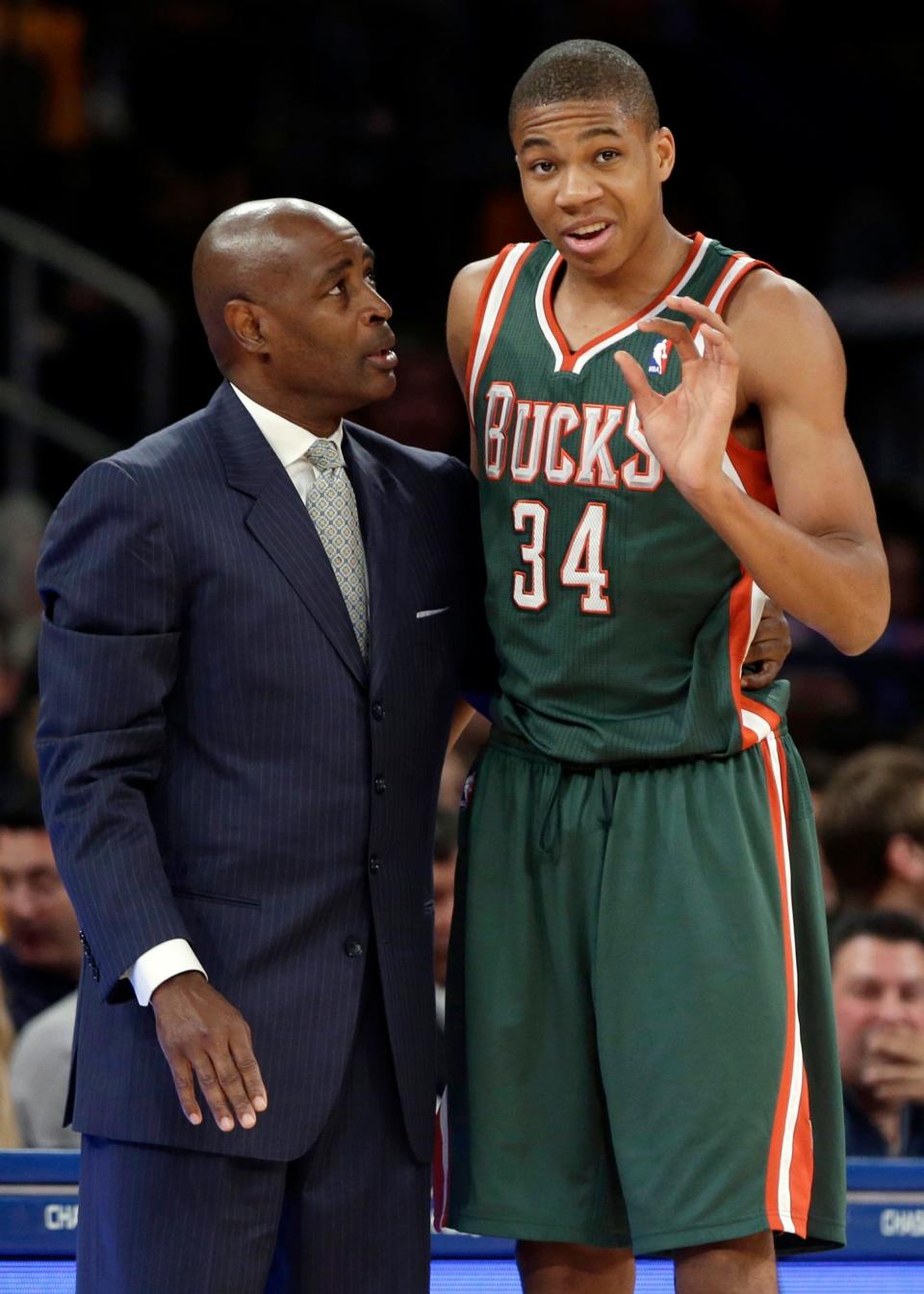 Milwaukee Bucks coach Larry Drew (left) talks to guard Giannis Antetokounmpo during the first half of an NBA basketball game against the New York Knicks in New York in 2013. The precocious 19-year-old rookie is providing an unexpected bright spot in an otherwise dismal season for the Bucks.