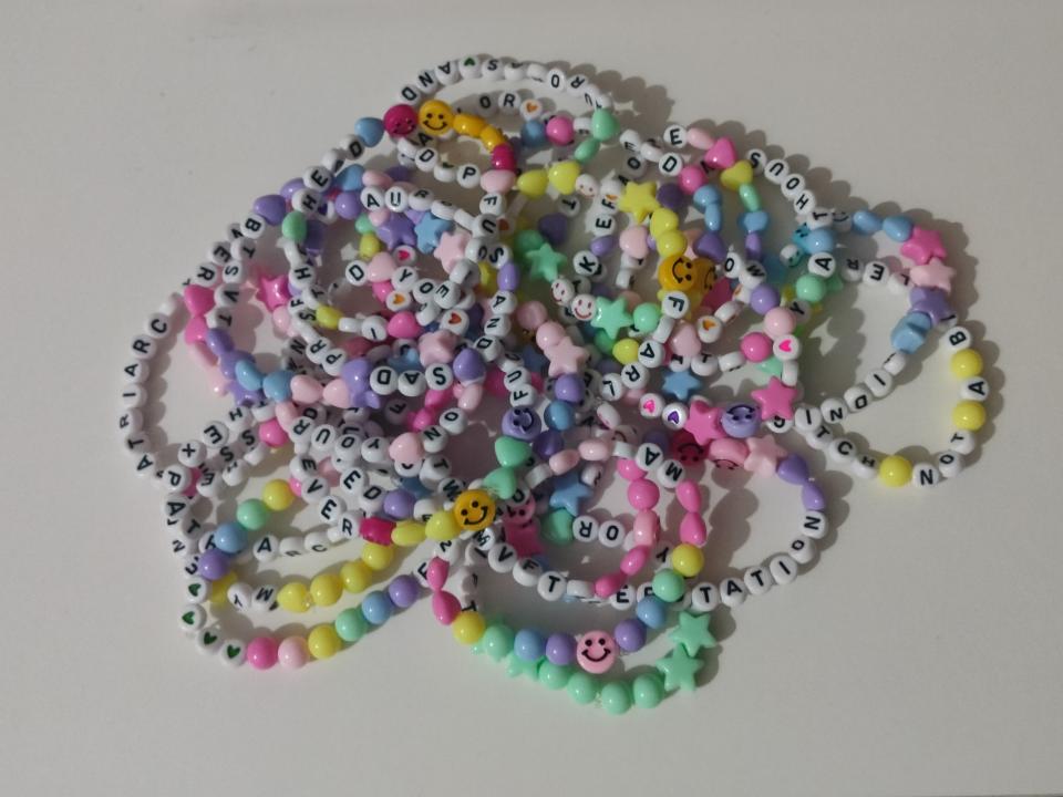A bunch of colorful beaded friendship bracelets made for Taylor Swift's Eras Tour concert in Singapore.