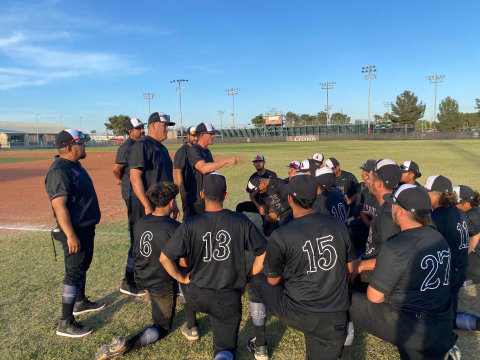 Alhambra baseball coach Shea Clark addresses the team after an 8-2 win over Brophy Prep in the 6A double-elimination tournament Thursday.