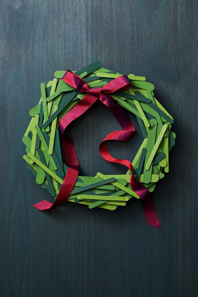 Wreath made from sheet music and wrapping paper. Glued together with hot  glue.