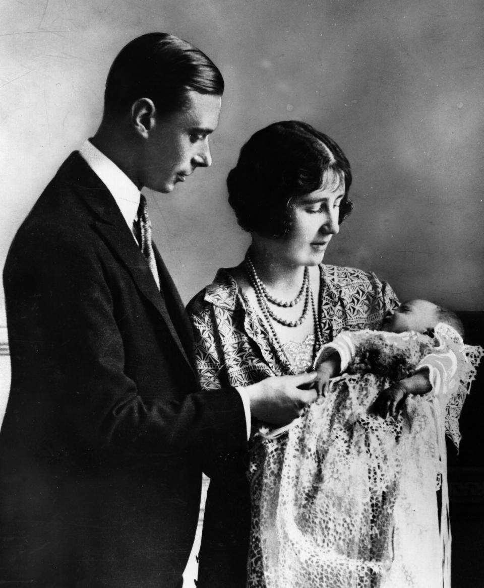 May 1926:  Future King and Queen, George, Duke of York (1895 - 1952) and Elizabeth Duchess of York (1900 - 2002) holding their first child, future Monarch Princess Elizabeth at her christening ceremony.  (Photo by Central Press/Getty Images)