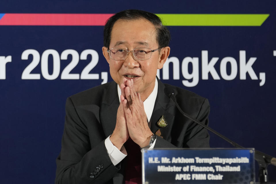 Thailand's Finance Minister Arkhom Termpittayapaisith gives the traditional greeting or "wai" after a press conference at the 29th Asia-Pacific Economic Cooperation (APEC) finance ministers' meeting in Bangkok, Thailand, Thursday, Oct. 20, 2022. Finance ministers of major Pacific Rim economies have pledged to combat inflation and seek sustainable growth at a meeting in Bangkok ahead of a summit next month. (AP Photo/Sakchai Lalit)