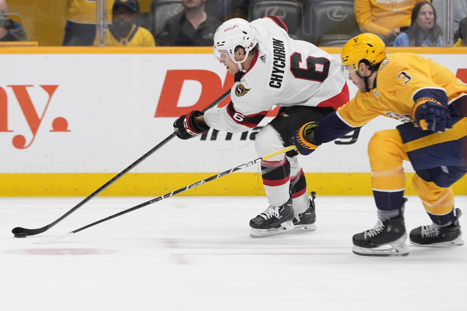 Ottawa Senators defenseman Jakob Chychrun (6) shoots the puck past Nashville Predators defenseman Jeremy Lauzon (3) during the first period of an NHL hockey game Tuesday, Feb. 27, 2024, in Nashville, Tenn. (AP Photo/George Walker IV)