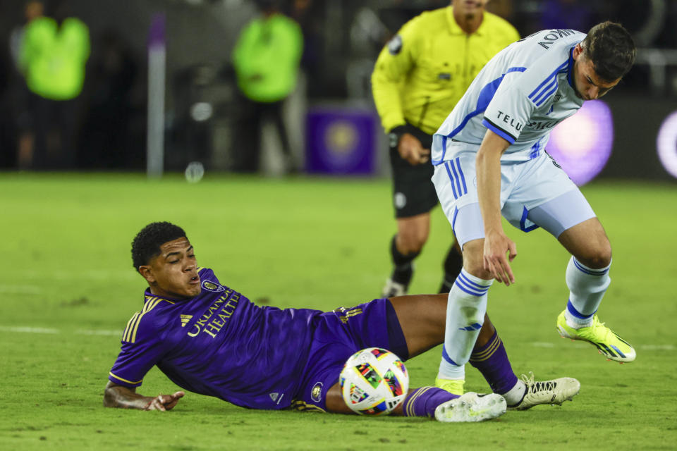 Orlando City midfielder Wilder Cartagena, left, defends against CF Montréal midfielder Dominic Iankov during the first half of an MLS soccer match Saturday, Feb. 24, 2024, in Orlando, Fla. (AP Photo/Kevin Kolczynski)