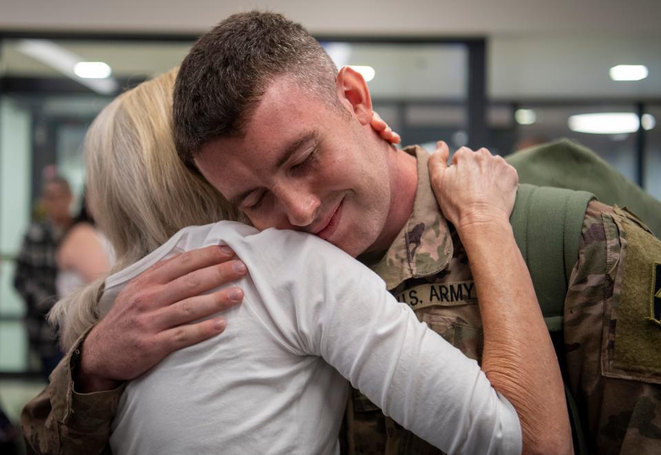 Karen Paulson hugs her son Ben Paulson upon arrival after spending a year in Iraq with the 1st Detachment of the 1st Battalion, 163rd Field Artillery of the Indiana Army National Guard at the Evansville Regional Airport Thursday, Aug. 3, 2023.