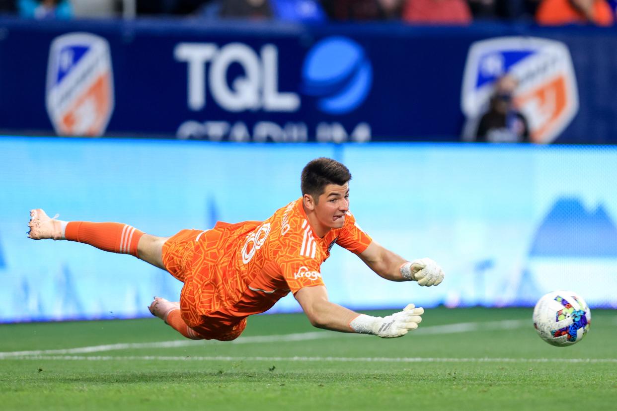 May 4, 2022; Cincinnati, Ohio, USA;  FC Cincinnati goalkeeper Roman Celentano (18) dives to make a save against the Toronto FC in the first half at TQL Stadium.