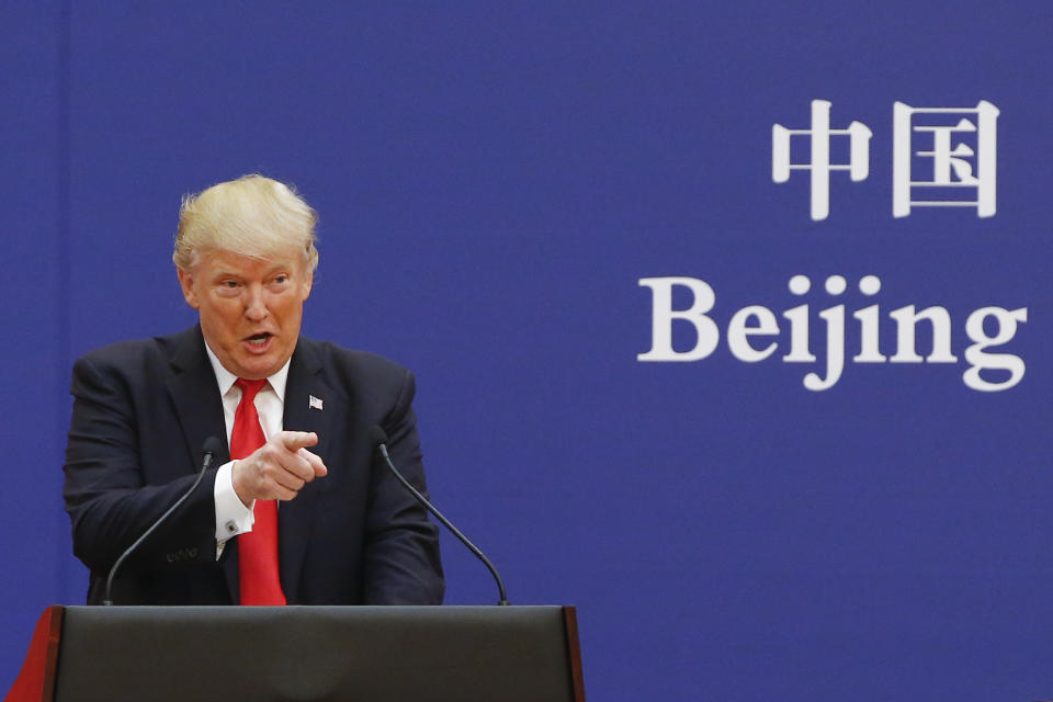 U.S. President Donald Trump and China’s President Xi Jinping (not shown) speak to business leaders at the Great Hall of the People on November 9, 2017 in Beijing, China. (Photo by Thomas Peter-Pool/Getty Images)