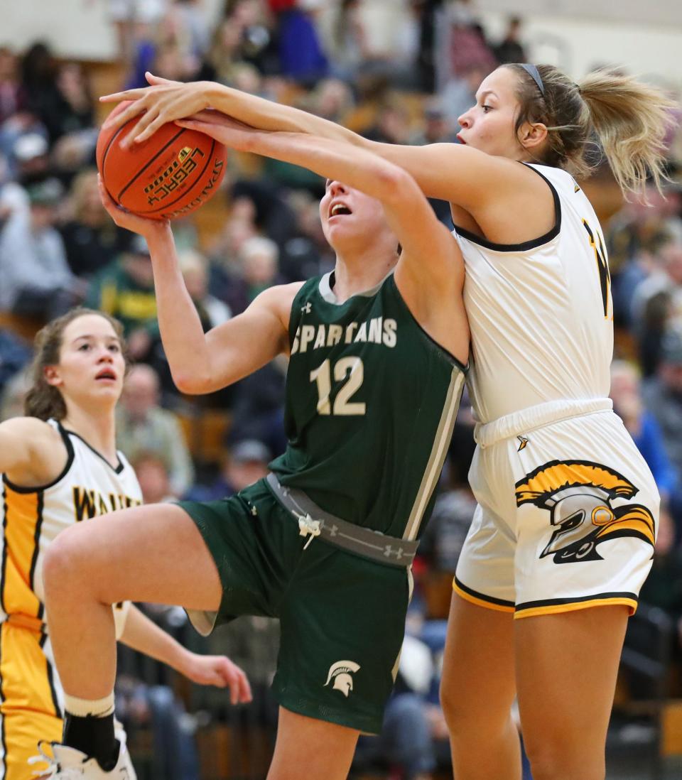 Waupun's Gabriela Matamoros, right, defends against Callista Vande Berg of Laconia during their game Nov. 23 in Waupun.