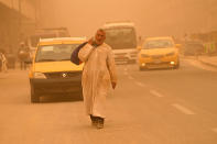 A man walks on a street during a sand storm in Baghdad, Iraq, Monday, May 16, 2022. (AP Photo/Hadi Mizban)
