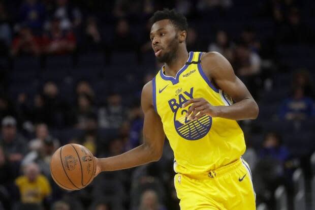 Golden State Warriors forward Andrew Wiggins has taken centre stage in the NBA's ongoing debate over COVID-19 vaccination. (Jeff Chiu/The Associated Press - image credit)