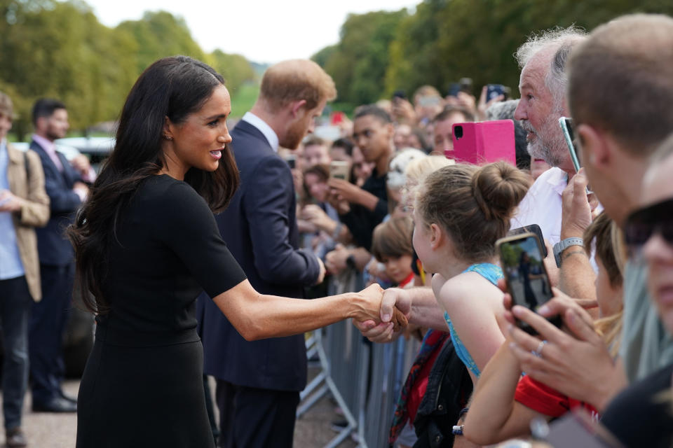 <p>Meghan, Duchess of Sussex and Prince Harry, Duke of Sussex meet members of the public at Windsor Castle on Sept. 10, 2022 in England. (Photo by Kirsty O'Connor - WPA Pool/Getty Images)</p> 