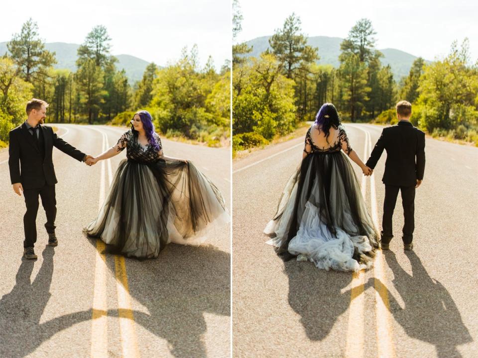 A front and back of a bride wearing a black dress and a groom wearing a black suit on a road with trees in the background.