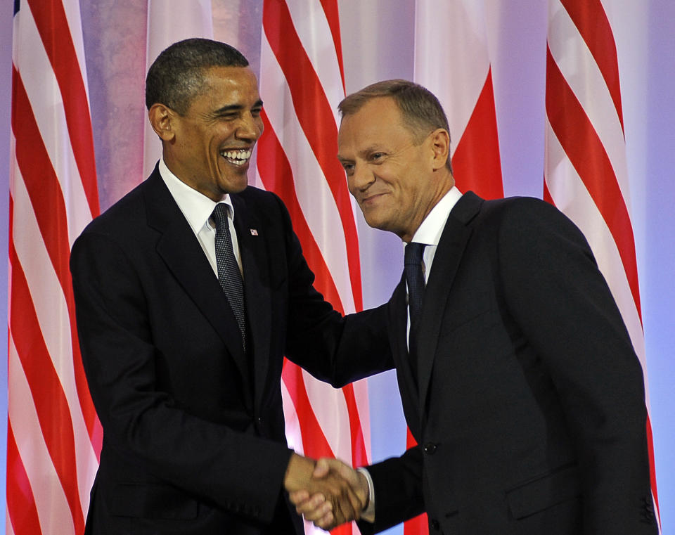 Polish Prime Minister Donald Tusk (R) shakes hands with U.S. President Barack Obama during their meeting in Warsaw on May 28, 2011.