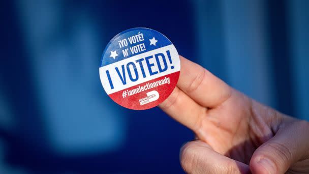 PHOTO: A person shows the Miami-Dade I voted sticker after exercising her vote during the Early Vote in Miami, Nov. 4, 2022. (Cristobal Herrera-Ulashkevich/EPA-EFE/Shutterstock)