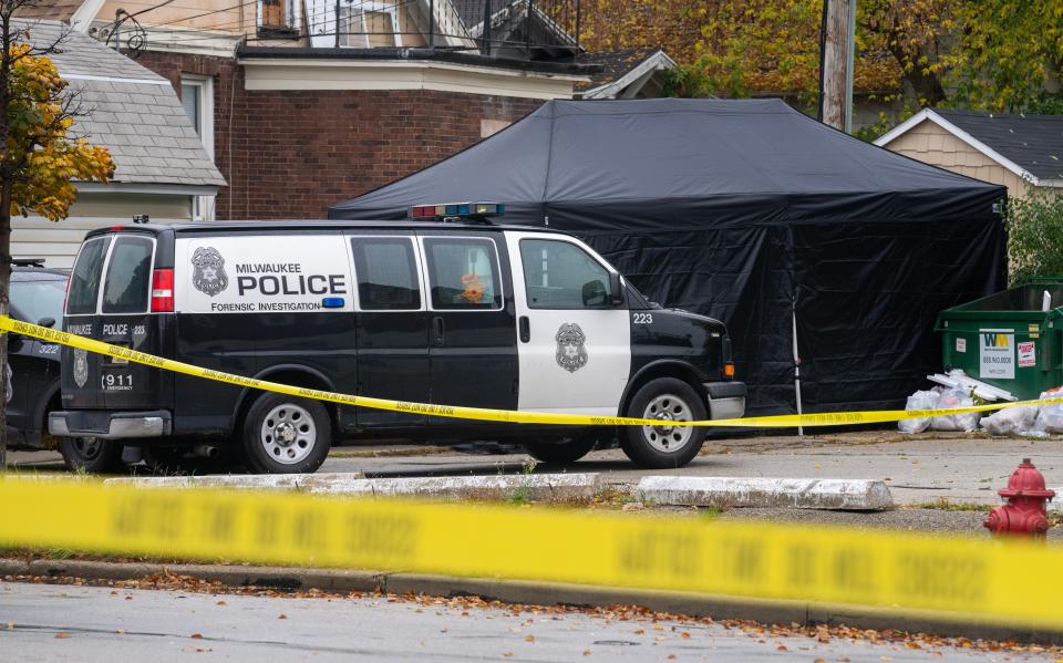 Police work at the scene of where a body was found in a dumpster Thursday, October 26, 2023 near the intersection of N. Hawley Rd. and W. Vliet Street in Milwaukee, Wisconsin.