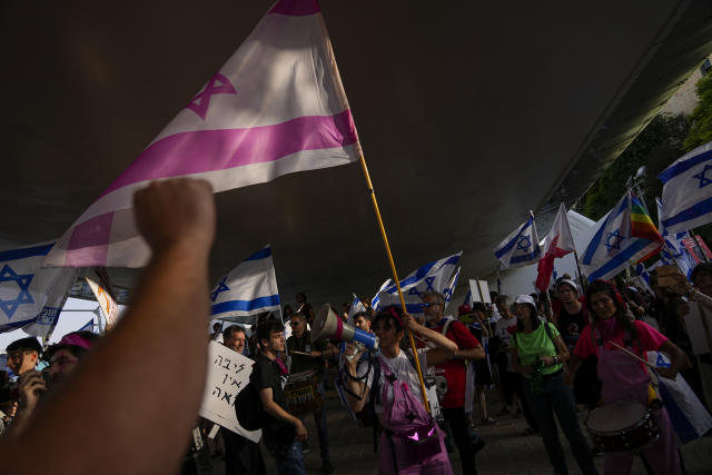 Israelis protest against a budget proposed by Prime Minister Benjamin Netanyahu's government ahead of a parliamentary vote and its plans to overhaul the country's judicial system in Jerusalem, Tuesday, May 23, 2023. (AP Photo/Ohad Zwigenberg)