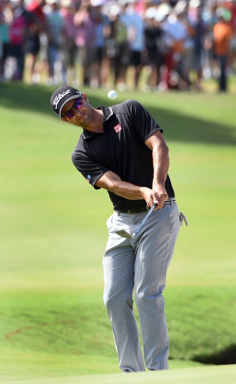 Australia's Adam Scott chips onto the green on the way to finishing in a tie for second place in the Australian Open golf tournament in Sydney on November 29, 2015