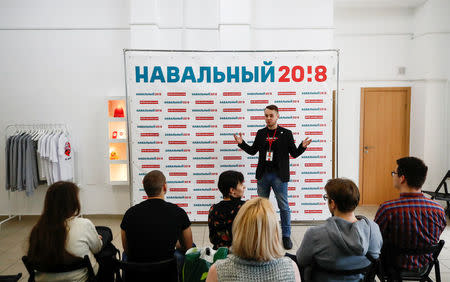 An instructor addresses activists and supporters of Russian opposition leader Alexei Navalny during a masterclass, dedicated to Navalny's campaign for a boycott of the upcoming presidential election, in Moscow, Russia February 10, 2018. Picture taken February 10, 2018. REUTERS/Maxim Shemetov