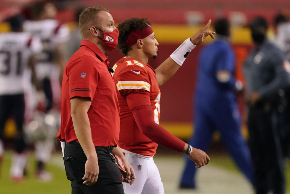 Kansas City Chiefs quarterback Patrick Mahomes, right, walks off the field after an NFL football game against the New England Patriots, Monday, Oct. 5, 2020, in Kansas City. The Chiefs won 26-10. (AP Photo/Charlie Riedel)