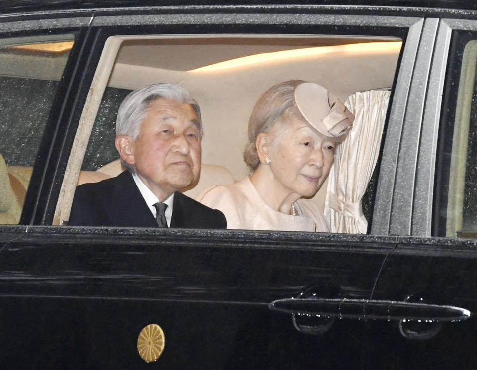 Japanese Emperor Akihito, left, and Empress Michiko, seen in a car, arrive at Ise Jingu Shrine in Ise, central Japan, Wednesday, April 17, 2019. (Kazushi Kurihara/Kyodo News via AP)