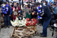 Presidential candidate Luis Arce from the Movement Towards Socialism Party, MAS, prepares an offering to the "Pachamama," or Mother Earth during his closing campaign rally in El Alto, Bolivia, Wednesday, Oct. 14, 2020. Elections will be held Oct. 18. (AP Photo/Juan Karita)