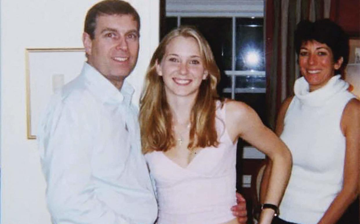 Prince Andrew, Virginia Giuffre, and Ghislaine Maxwell (left to right) posing for a photo - AFP