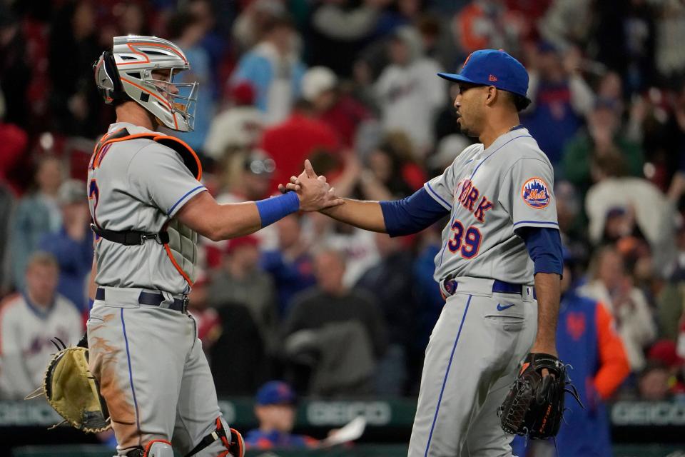 New York Mets relief pitcher Edwin Diaz (39) and catcher James McCann celebrate a 3-0 victory over the St. Louis Cardinals in a baseball game Tuesday, April 26, 2022, in St. Louis.