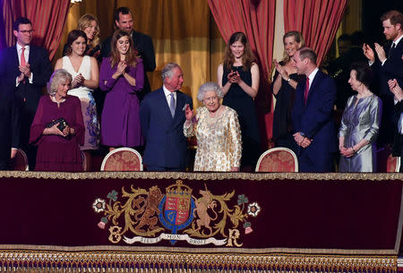 Britain's Queen Elizabeth, surrounded by members of the royal family, waves during a special concert "The Queen's Birthday Party" to celebrate her 92nd birthday at the Royal Albert Hall in London, Britain April 21, 2018. John Stillwell/PoolÊviaÊReuters