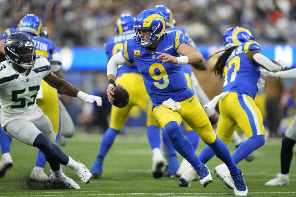 Los Angeles Rams quarterback Matthew Stafford (9) scrambles during the second half of an NFL football game against the Seattle Seahawks Sunday, Nov. 19, 2023, in Inglewood, Calif. (AP Photo/Ashley Landis)