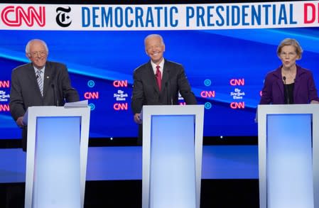 Democratic presidential candidate Senator Bernie Sanders and former Vice President Joe Biden listen to Senator Elizabeth Warren as they debate during the fourth U.S. Democratic presidential candidates 2020 election debate in Westerville, Ohio