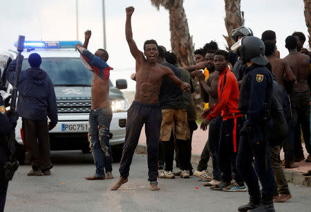 An African migrant celebrates after crossing a border fence between Morocco and Spain's north African enclave of Ceuta October 31, 2016. REUTERS/M. Martin