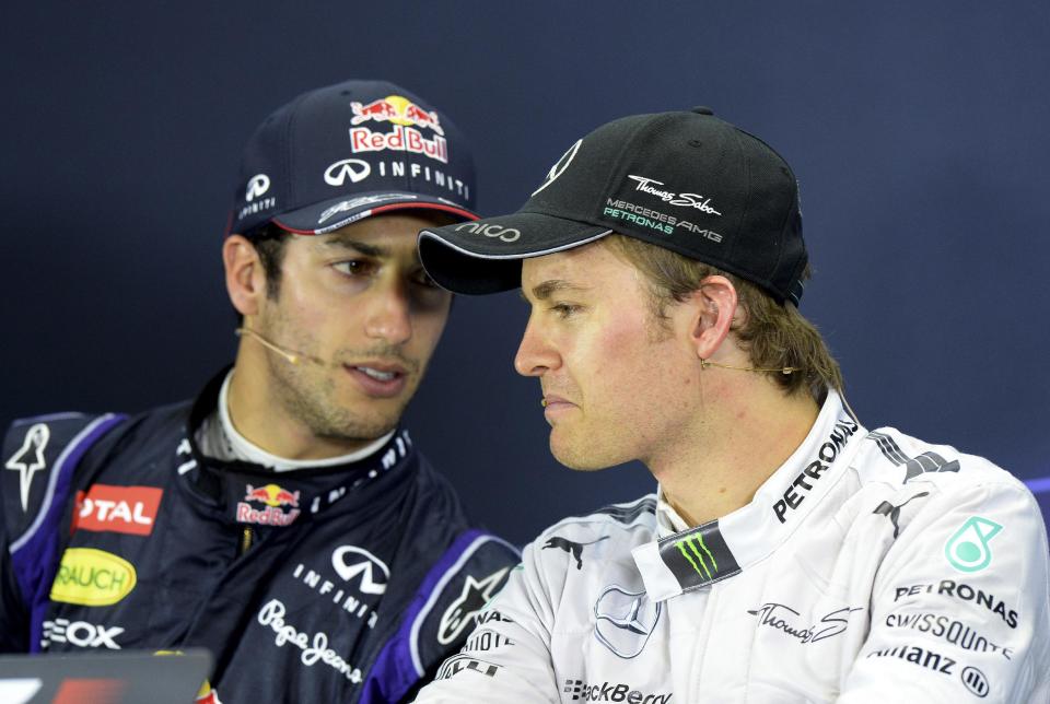 Red Bull driver Daniel Ricciardo of Australia left, and Mercedes driver Nico Rosberg of Germany chat during a press conference after the Australian Formula One Grand Prix at Albert Park in Melbourne, Australia, Sunday, March 16, 2014. Rosberg won the race and Ricciardo finished second. (AP Photo/Mal Fairclough)