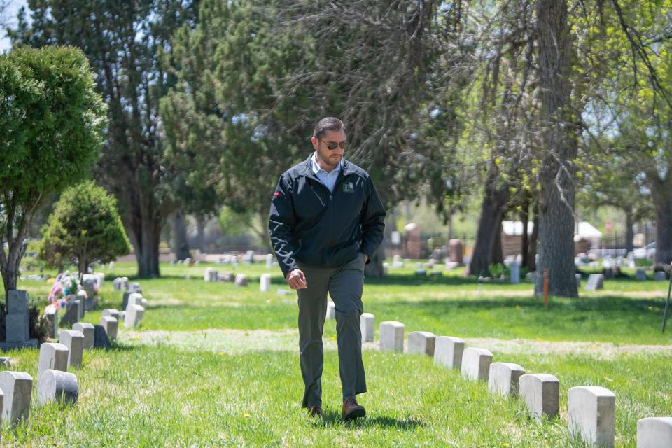 Jose Ramirez, project manager for Next Chapter, walks the grounds of Roselawn Cemetery on Wednesday, April 24, 2024.