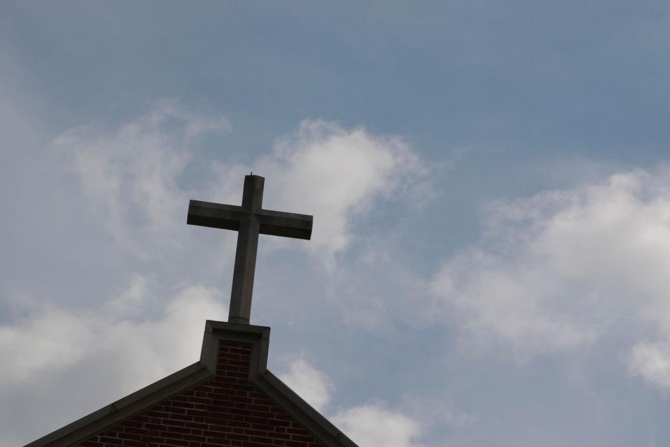 FILE - A cross sits on top of Trinity on the Hill United Methodist Church on Feb. 23, 2023. Trinity recently won a lawsuit to disaffiliate from the North Georgia Conference of the United Methodist Church.